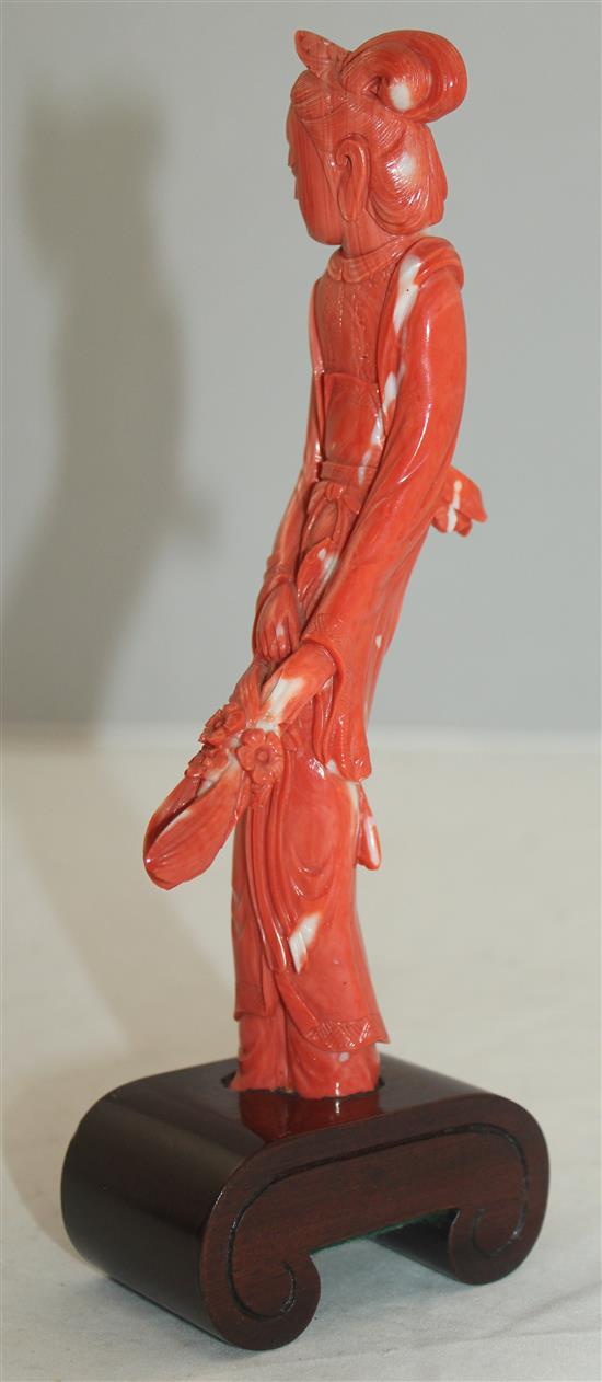 A Chinese coral figure of a beautiful lady, 20cm incl. wood stand